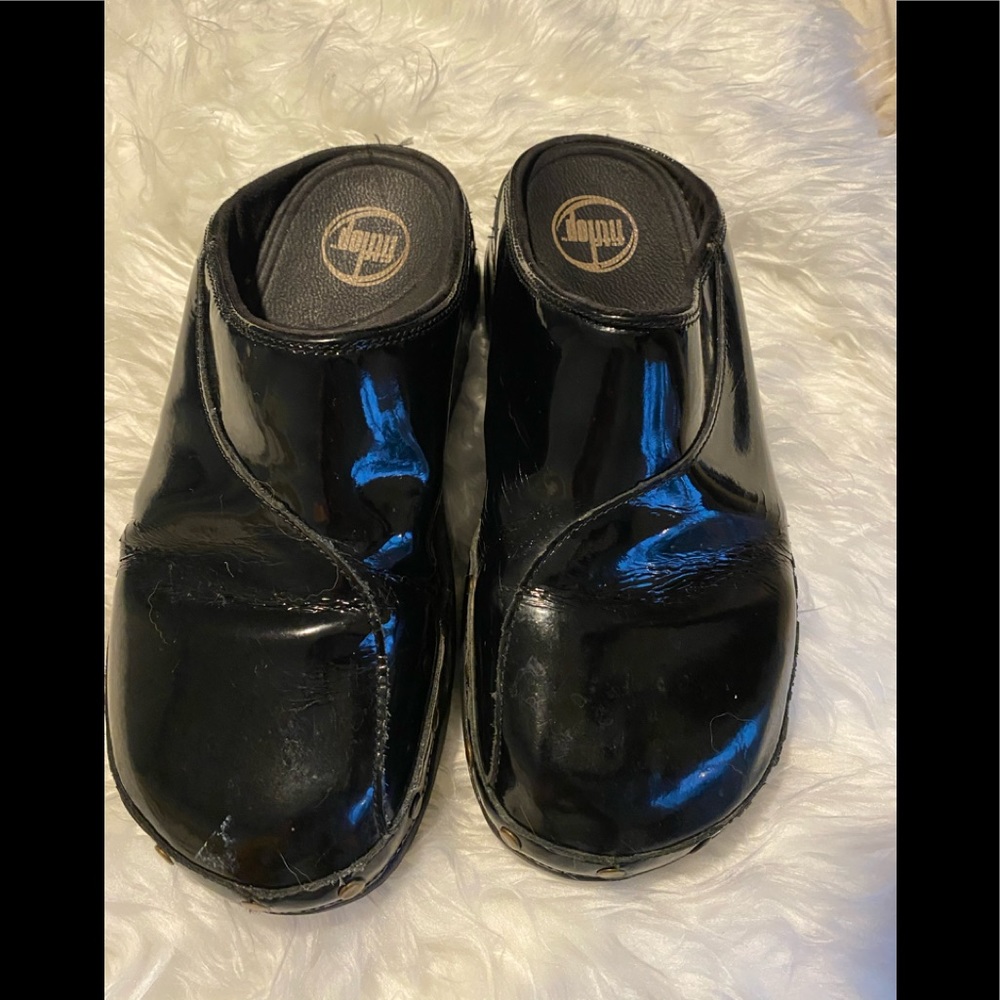 Well loved FitFlop patent black clogs